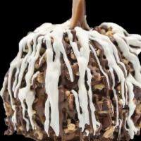 Pecan À La Mode Apple · A Granny Smith apple covered in fresh caramel then rolled in chopped pecans, drizzled in mil...