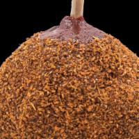 Chamoy Apple · A Granny Smith Apple Coated In A Mixture Of Mango And Chamoy Rolled In A Sweet And Salty Sea...