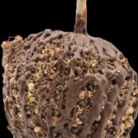 Caramel Apple Ft. Heath Bar · A Granny Smith apple covered in fresh caramel, rolled in crushed heath bar drizzled with mil...