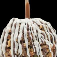 Almond À La Mode Apple · A Granny smith apple covered in fresh caramel then rolled in almonds, drizzled in milk choco...