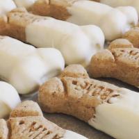 Medium Size Dog Bones Dipped In White Confection · Milk dog bone dipped in white confection, small treat. We have 13 small dog bones in a clear...