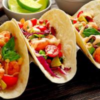 Grilled Fish & Grilled Shrimp Taco · Fresh caught white fish, hearty prawns, cabbage, pico de gallo, and sour cream folded into a...