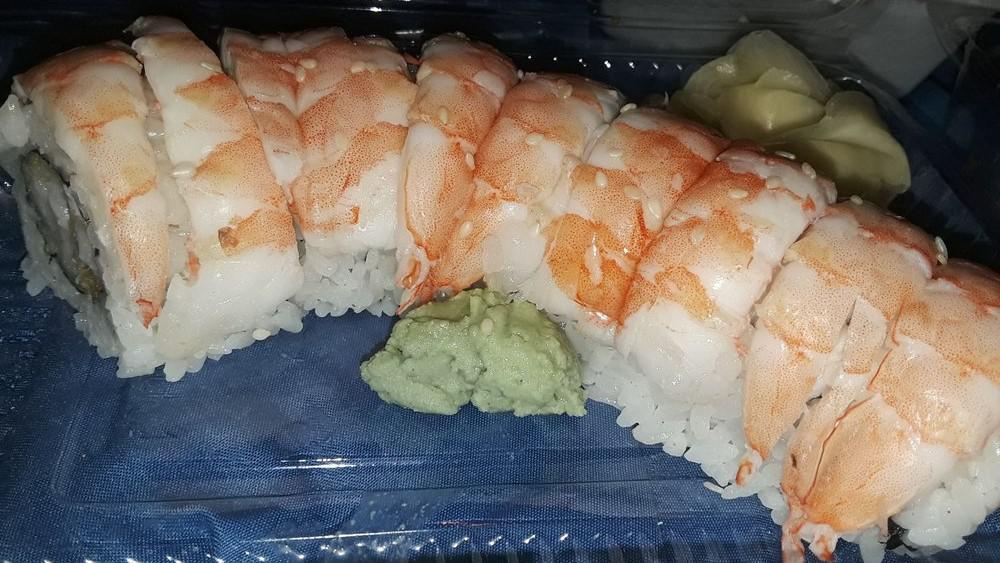 Tiger Roll · Inside-fried shrimp, crab, avocado, cucumber outside-cook shrimp.