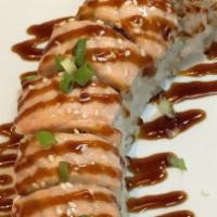 Baked Salmon Roll · Inside- crab, avocado, cucumber outside-baked salmon with eel sauce.