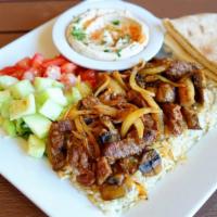 Steak Kebab Plate · Tender pieces of marinated steak with grilled onions and mushrooms; served with hummus, pita...