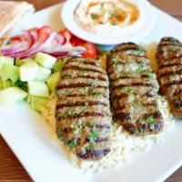 House Ground Beef Kebab Plate · Seasoned ground beef, char-broiled to perfection; served with tahini sauce, hummus, pita bre...