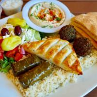 Veggie Combo Plate · Best of all. Spinach pie, falafel, dolma, hummus, Greek salad, pita bread, and Rice, Brown R...