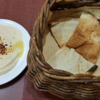 Hummus · Cooked, mashed garbanzo beans, blended with tahini, olive oil, salt and garlic.