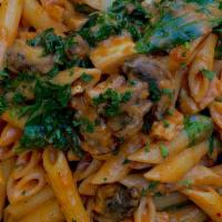 Vegan Florentine Pasta  · 100 % VEGAN PENNE PASTA, TOMATOES, MUSHROOMS, AND SPINACH  TOSSED IN OUR HOMEMADE COCONUT CR...