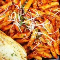 Spicy Arrabbiata Pasta · Penne pasta tossed in our homemade spicy sauce made with garlic, tomatoes and chili peppers ...