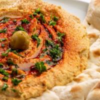 Fresh Homemade Hummus · Freshly made hummus served with extra virgin olive oil
