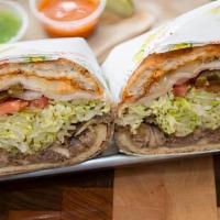 Cubana Torta · Pork, ham, breaded steak and turkey with beans, jalapeno, onion, tomato, lettuce, cheese, av...