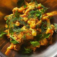 Curry Cauliflower · roasted cauliflower, pepitas, raisins, curry yogurt, herbs