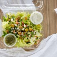 Greek Salad (L) · Greek salad is served with lettuce, veggie mix, olive and feta cheese tzatziki and chutney s...