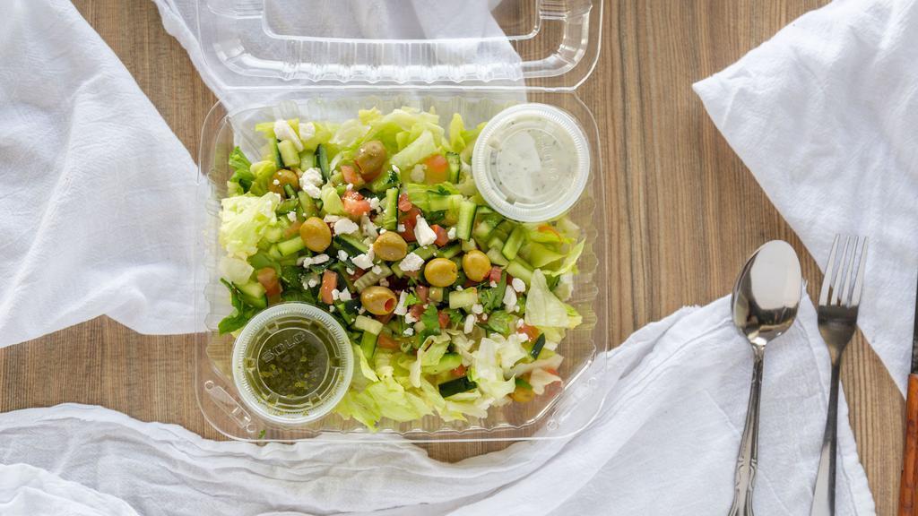 Greek Salad (L) · Greek salad is served with lettuce, veggie mix, olive and feta cheese tzatziki and chutney sauces.