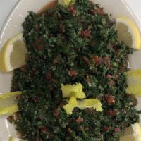 Tabouleh · Minced parsley, tomatoes, wheat, mint, onions, olive oil, and lemon juice.