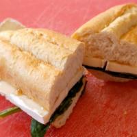 Homemade Baguette Brie · HomeMade Half Baguette, Served With Brie Cheese, Honey, Spinach Lettuce And Our French Butte...