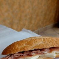 Homemade Baguette Jambon Beurre · HomeMade Half Baguette, Served With 3 Slices of Prosciutto Ham and French Butter Of Course!