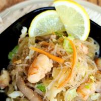 Pancit · clear noodles sauteed in chicken and shrimp with veggies