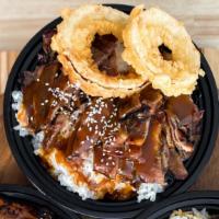 Pork · Fresh off the grill pork over rice topped with Teriyaki glaze + 2 onion rings
