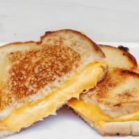 Classic Grilled Cheese · Do we even have to tell you? Melty American cheese between two slices of buttery grilled bre...