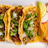 Tacos  · Corn hand made tortilla/ with choice of meat/ comes with onions and cilantro hot souce on th...