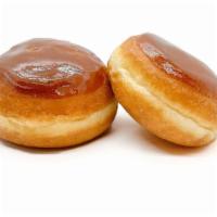 Creme Brulee Donut · Yeast donut filled with Bavarian cream filled and topped with a layer of hardened caramelize...