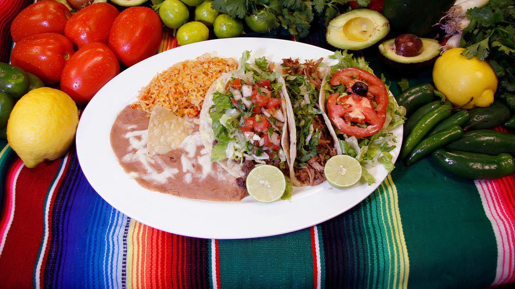 Two Tacos (Combo) · Two regular tacos with your choice of meat, a side of rice and beans.