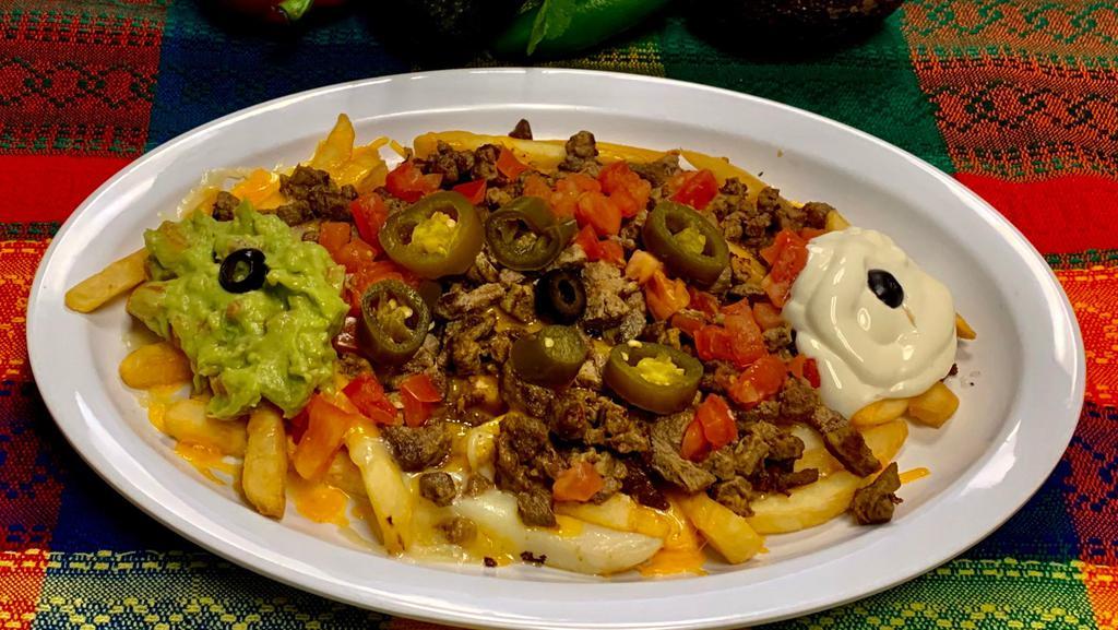 Nacho Fries · Fries with your choice of meat, cheese, guacamole, sour cream, jalapeños, tomatoes, and olives.