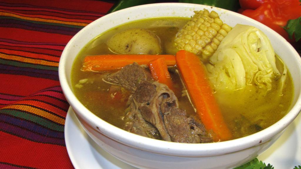 Caldo De Res · Cocido/Beef stew served with potatoes, carrots, squash, beef and a side of rice/tortillas.