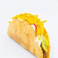 The Crispy Taco Supreme · Seasoned Plant-Based Beef by Abbot's Butcher, iceberg lettuce, radish, taco sauce and suprem...