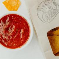 Chips & Salsa · House-made salsa roja with non-GMO tortilla chips