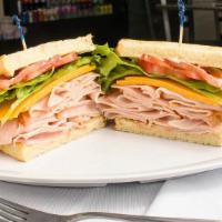 Turkey Sandwich · Turkey with mayo, lettuce, tomato, and your choice of cheese on your choice of bread.