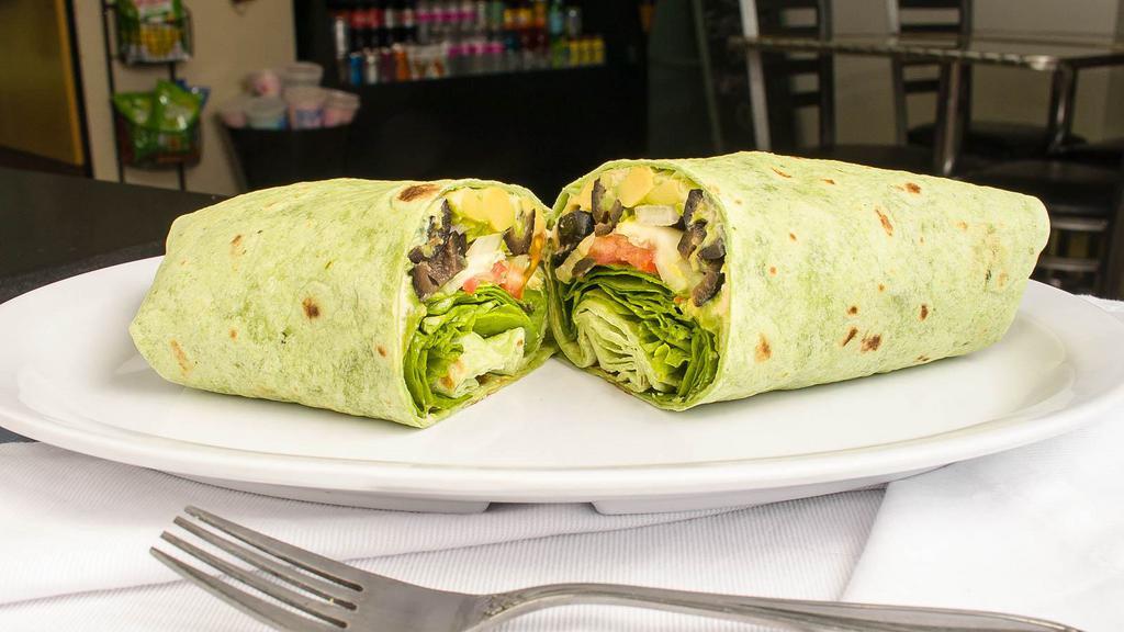 Veggie Wrap · Tomato, spinach, onion, avocado, cucumber, olives, lettuce, your choice of hummus, pesto, or spicy mayo on a spinach wrap.