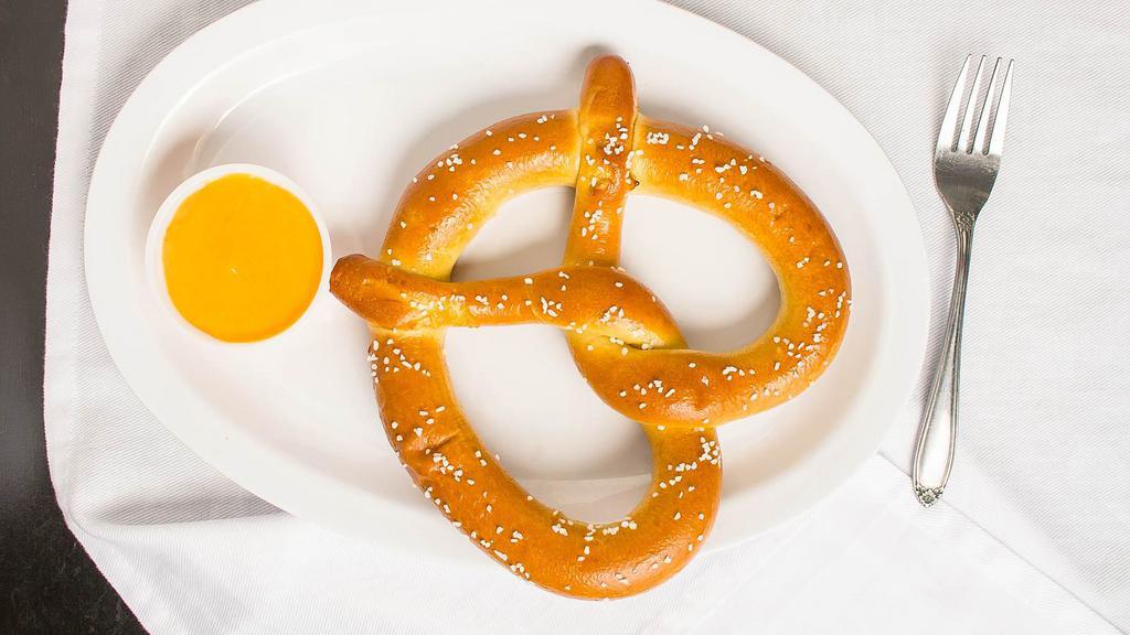 Pretzel · Soft pretzel with butter and salt, cheese is extra.