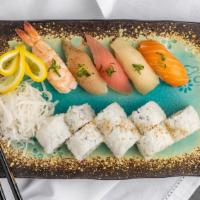 Assorted Sushi And California Roll · Tuna, salmon, yellowtail, shrimp, and Albacore (nigiri) with a California roll.