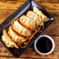 Deep Fried Dumpling (6 Pieces) · Choice of chicken or vegetable, served with  vinaigrette sweet black sauce.