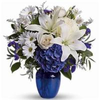 Beautiful In Blue · Beautiful blooms such as blue hydrangea, crème roses, white lilies and alstroemeria along wi...