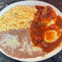 Huevos Rancheros · Two eggs laid on top of a corn tortilla, topped with mild red sauce and served with rice and...