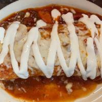Burrito Supreme Dinner · Rice, beans, and your choice of meat in a flour tortilla, topped with your choice of red or ...