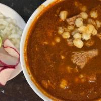 Pozole Rojo (Red) · A traditional red soup with hominy and pork. Served with cabbage, radish, onions, lime, and ...