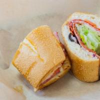 The Italian Sandwich · Italian vinaigrette, salami, pepperoni, capicola, mortadella, provolone, tomatoes, onions, b...