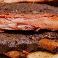 St Louis Ribs 1/2 · Cooked over oak, pecan, and cherry. Served with BBQ sauce and pickles.