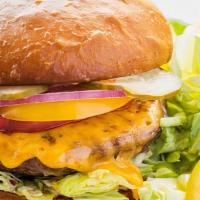 Backyard Burger · 6oz Grass-fed beef, heirloom tomato, shaved red onion, house pickles, butter lettuce, brioch...