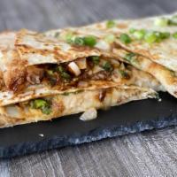 Pork Belly Quesadilla · Sliced pork belly with cheese, hoisin sauce, cilantro, scallions, onions, wrapped in a Chine...