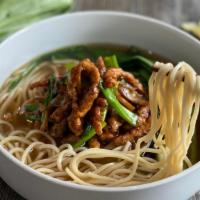 Shredded Pork Noodle Soup · Taiwanese noodles, savory sautéed pork, chinese pickles, bamboo shoots, scallions, bok choy