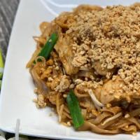 Pad Thai · thin thai rice noodles, tamarind sauce, egg, bean sprouts, scallions, onions, topped with cr...