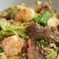 Yang Chow Fried Rice · wok-tossed rice stir-fried with fresh lettuce, egg scallions, onions, green peas