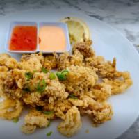 Calamari · Lightly fried calamari served with sweet chili sauce & spicy aioli, choice of spicy, regular...