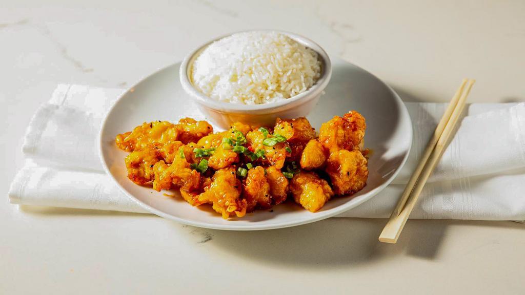 Orange Chicken · Crispy chicken or shrimp tossed in a sweet orange sauce, served with rice.